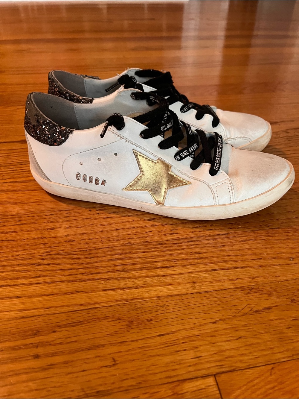 Golden Goose Superstar Sneakers with Gold Star Accent and Black Glitter Heel